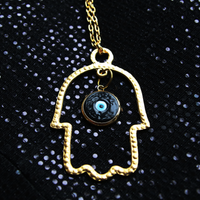 Gold Hamsa Statement Necklace with Black and Gold Evil Eye