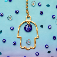 Gold Hamsa Statement Necklace with Blue and Gold Evil Eye